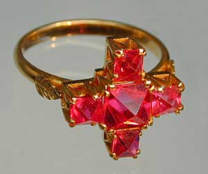 This Burmese spinel ring features nat thwe spinel octahedra, which have received only light polishing. (Photo: John McLean ; Ring: William Larson Collection )