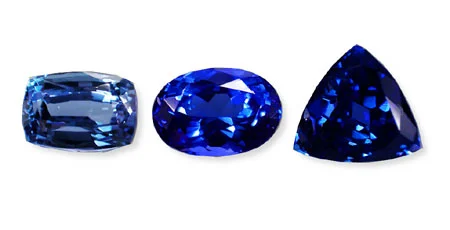 This suite of tanzanites shows the typical range of colors possible. The ideal would be the center stone, which is not too light or dark. (Photo: Wimon Manorotkul; Gems: Pala International)