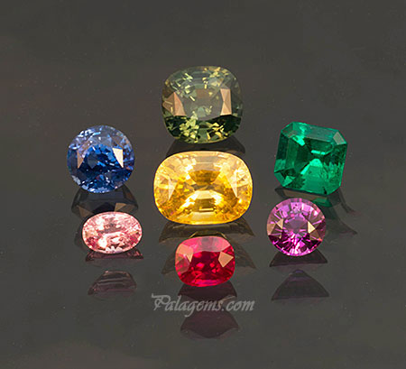 Kasting call. (From center, then clockwise from top) Golden yellow sapphire from Sri Lanka, 6.40 ct, 12.1 x 9 .1 mm cushion; unique green sapphire from Sri Lanka, 6.18 ct, 10.2 x 9.9 mm cushion; very fine emerald from Colombia, 2.66 ct, 8.9 x 8.4 mm emerald cut; intense purple pink sapphire 1.90 ct, 7.2 mm round; pigeon's blood red ruby from Burma, 2.08 ct, 7.3 x 6 mm cushion; exquisite padparadscha from Sri Lanka, 1.25 ct, 7.2 x 5.2 mm oval, brilliant blue sapphire 4.04 ct, 8.5 mm round. (Photo: Jason Stephenson)