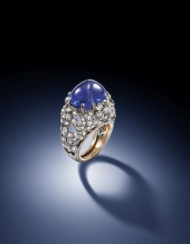 Sapphire and diamond ring, ca. 1925. The sugarloaf cabochon weighs 21.27 carats, within an openwork mount of stylised floral and foliate design, decorated with rose-cut diamonds, mounted in silver and gold. (Photo courtesy Bonhams)