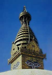 Figure 1. The Buddhist temple at Swayambunath, Nepal, is shown silhouetted against a deep blue sky. The photo was taken in November, 1988, at approximately 1:30 PM. Again, the blueness of the sky results from lack of dust and moisture in the air. One can see from Figures 1 and 2 how such blue skylight might easily enhance the appearance of blue stones. Photo: Richard W. Hughes .