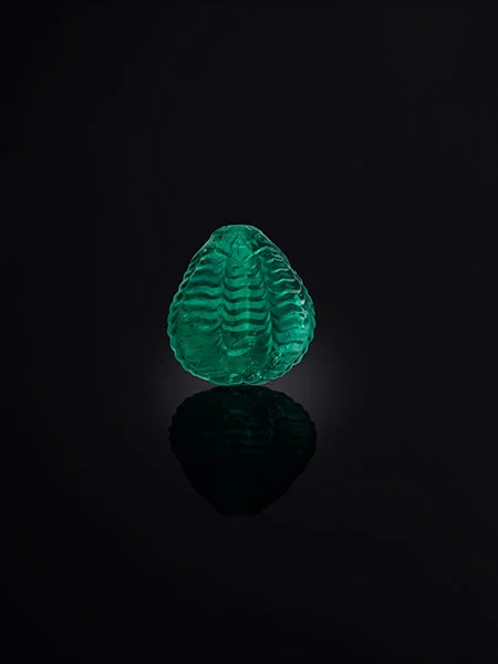 The Al Thani Collection. Carved emerald bead, probably 18th century, Mughal Empire. (© Servette Overseas Limited, 2014. Photograph: Prudence Cuming Associates Ltd)