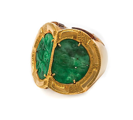 Lot 240 is a ring by David Webb from the Hassenfeld collection. It features two semicircular pierced jadeite plaques (17.47 x 12.71 mm) that appear to be carved in the form of stylized butterflies. (Photo courtesy Leslie Hindman Auctioneers)