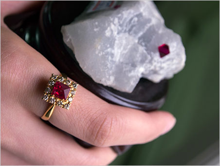 Best known for ruby, Mogok also produces exquisite spinels. Some of these octahedral crystals are so perfect that they are termed nat-twe (angel polished). The photo shows a completely natural spinel crystal mounted in a ring, along with a natural spinel octahedron in the marble mother rock. From Mogok Geology Primer. (Specimens courtesy of Dr. Saw Naung U family; Photo: Wimon Manorotkul/ Lotus Gemology )