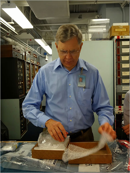Jeffrey Post, Curator-in-Charge of the Smithsonian's Mineral Collection, unpacks the Blue Moon Diamond prior to testing in the Institution's highly secure Blue Room. (Photo: Eloïse Gaillou)