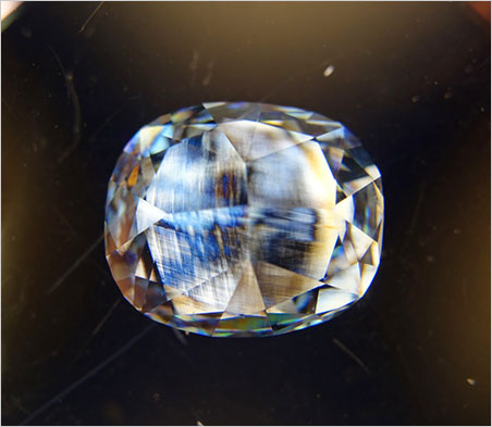 From Eloïse Gaillou: Finally, we were curious to look at the remaining strain inside the diamond structure. All natural diamonds show some strain features, and the Blue Moon is no exception. The colored striations are the evidence of such a strain. (Photo: Eloïse Gaillou, in between cross-polarizers)