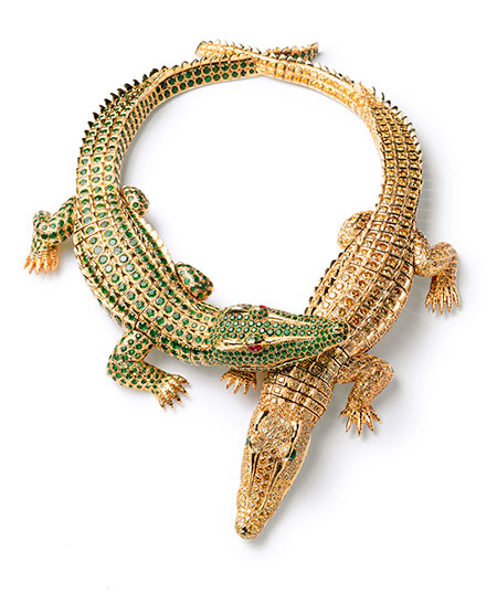 Crocs. Crocodile necklace worn by Mexican actress María Félix (1914–2002), pictured below, who eschewed Hollywood yet made films with everyone from Miguel Zacarías and Fernando de Fuentes to Jean Renoir and Luis Buñuel. The necklace is completely articulated, crafted from gold, two ruby cabochons, 1,023 yellow diamonds (60.02 tcw), and 1,060 emeralds (66.86 tcw), measuring 30 cm and 27.3 cm in length. When worn as a brooch, the tucked-in legs of each segment are replaced. It is said that Félix dropped off her own pet crocodile to serve as model, but cautioned that her baby was growing. It took two years to create the necklace. Cartier Collection. (Photo: Nick Welsh, Cartier Collection © Cartier)