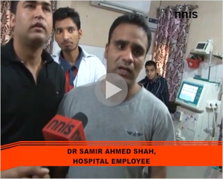 Why is this man not smiling? Last month, we asked a variation of this question, pointing to a streaming video of a harrowing journey to the Kashmir sapphire mines. This month, the state of Jammu and Kashmir is underwater. Above, a doctor in Srinigar laments the conditions in his hospital, which is without power and running out of medicine and other supplies. Our hearts go out to the people of India and Pakistan. Relief is being given by the IFRC .