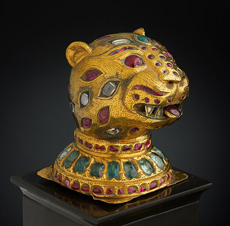 Finial from the Throne of Tipu Sultan , South India, Mysore, ca. 1790. Gold, inlaid with diamonds, rubies, and emeralds; lac core. H. 2-3/4 in. (6.8 cm), W. 2-1/8 in. (5.4 cm), D 2-1/4 in. (5.5 cm). Al-Thani Collection. (Photo: © Prudence Cuming Associates)