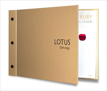 The Lotus Solid Gold Report, pictured above, is devoted only to unenhanced gemstones (other than cutting and polishing). The 15+ page hardcover report is augmented with color photographs and maps. One gemstone dealer, impressed with the reports, declared, "These reports will help me close sales." (Photo courtesy Lotus Gemology)
