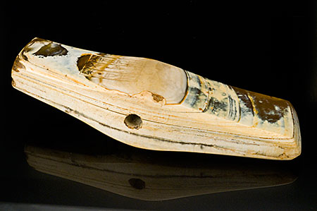This photograph of the axe head shows the inscription on the object’s reverse at left. (Photo: Mia Dixon)