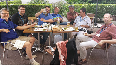 À votre santé. Will Larson raises a beaker of gluten-free ale surrounded by family and friends: Bill Larson, Carl Larson (Toastmaster), Malte Sickinger, Marcus Walter, Mark Kaufman, and George Hickox. No doggy bag needed for the foie gras. (Photo: Eloïse Gaillou)