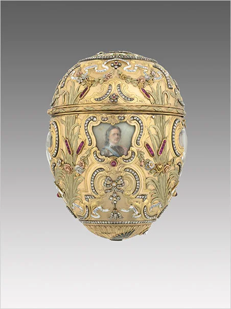 Carl Fabergé (1846–1920), Fabergé workshop, Mikhail Perkhin (workmaster). Imperial Peter the Great Easter Egg , 1903. Egg: gold, platinum, silver gilt, diamonds, rubies, enamel, watercolor, ivory, rock crystal. Surprise: gilt bronze, sapphire. Egg: 12 x 7.9 cm, Surprise: 4.7 x 6.9 cm, Stand: 7.7 x 6.9 cm, Virginia Museum of Fine Arts, Bequest of Lillian Thomas Pratt. Click images to enlarge. (Photos courtesy The Montreal Museum of Fine Arts)