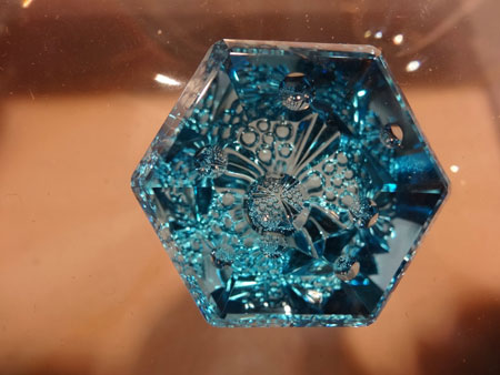 Recto/verso. Okay, blue topaz is supposed to be a kind of a joke in the industry; a dime a dozen. But all kidding is shoved aside in the hands of a lapidary with vision. From the Somewhere In The Rainbow collection. Gaillou: "They have some of the most amazing rare gemstones I've even seen." (Photo: Eloïse Gaillou)