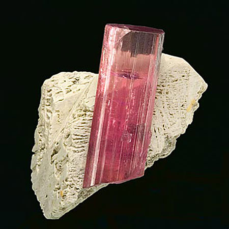 Chapter 6 (along with the others) contains examples of lovely mineral specimens like this tourmaline from the Himalaya Mine in Mesa Grande, California, with etched feldspar. (Photo: John McLean, Pala International)