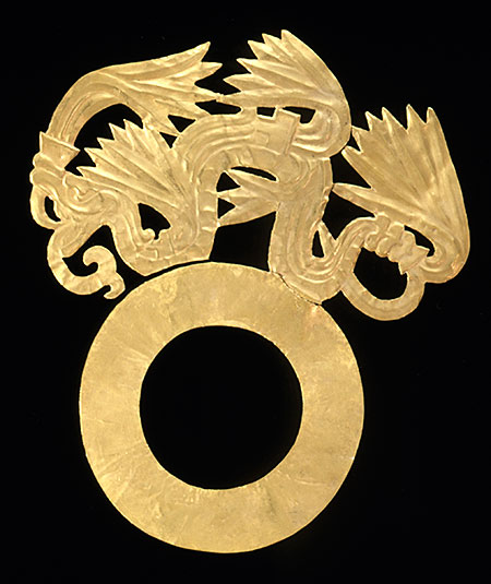 Gold mask ornament , hammered and delicately embossed. Made from imported gold, this eye piece once decorated the ceremonial mask of a priest or ruler. Writhing feathered serpents formed "brows" above the eye holes. (Photo © President and Fellows of Harvard College, Peabody Museum of Archaeology and Ethnology, 10-71-20/C7679, 98600128)
