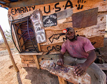 A miner named Obama , below, sorts ruby outside his hut at Winza, Tanzania, 2013. (Photo: E. Billie Hughes)
