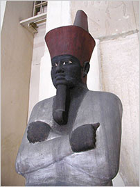 Painted sandstone seated statue of Nebhepetre Mentuhotep II, 11th Dynasty, Egyptian Museum, Cairo. (Photo: Jon Bodsworth)