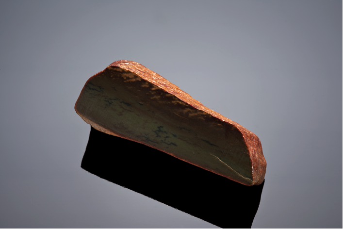 A darker brownish cut piece of Wyoming jade with dendrites is pictured above.