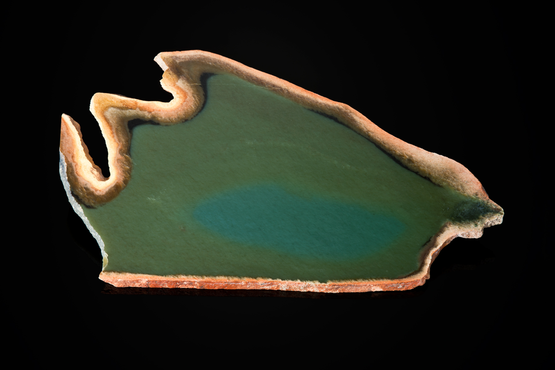This patterned jade shows the much desired illusive bluish jade in the center. I have seen a 10-lb block of this jade that showed nice translucency, but the price was beyond my disposable income. The piece is 7" long and about 3" high. (Photo: Robert Weldon)