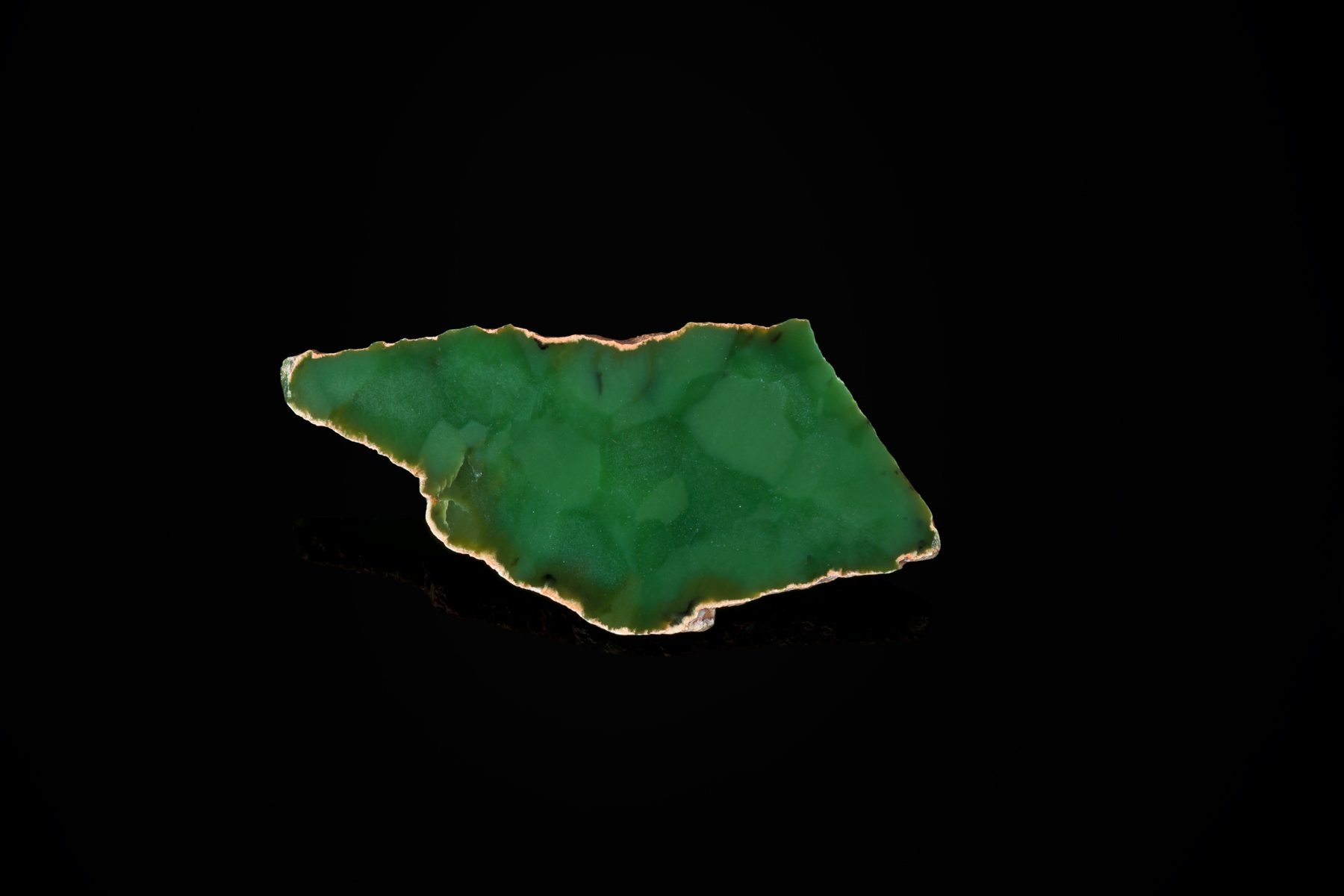 Above is shown an apple-emerald green slice of what is termed "turtle back" due to the quartz pseudomorphs imbedded in this small slice. (Photo: Robert Weldon)