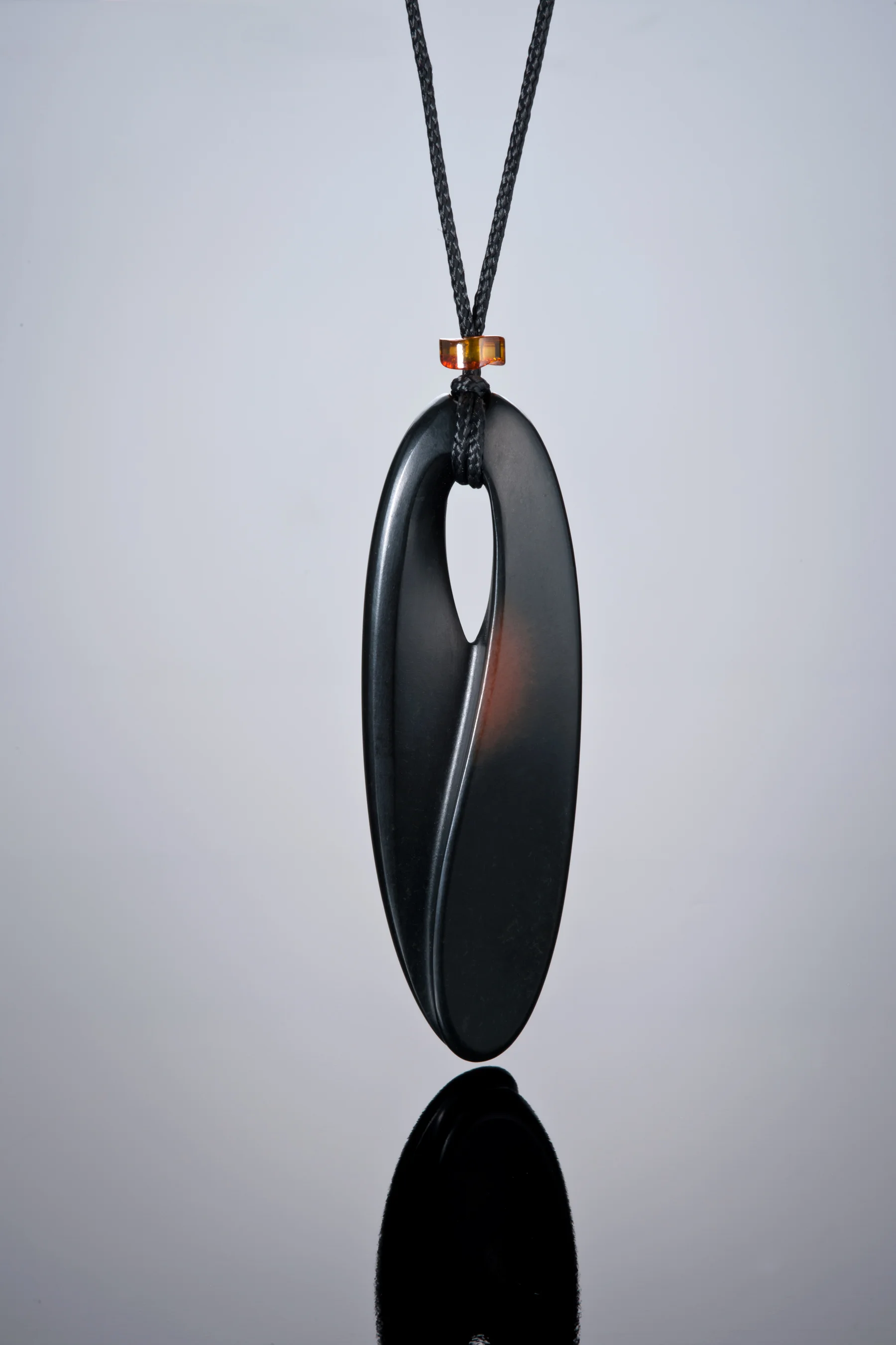 Above is a 3-inch pendant carved by Peter Schilling from Edward's claim Wyoming black jade with some of the rind shown. (Photo: Robert Weldon)
