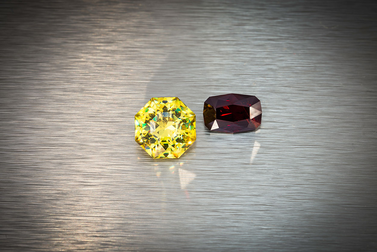 Cousins. Left, sphalerite from Spain, 11.34 ct., 12.8 x 12.8 x 8.5 mm. Right, rare wurtzite from Mahenge, Tanzania, 5.81 ct., 12.4 x 8.3 x 6.2 mm. Both of these stones were custom cut by Brett Kosnar. Prices available upon request. (Photo: Mia Dixon)