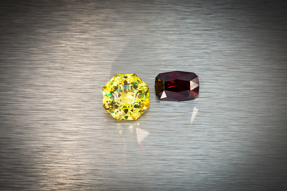 Cousins. Left, sphalerite from Spain, 11.34 ct., 12.8 x 12.8 x 8.5 mm. Right, rare wurtzite from Mahenge, Tanzania, 5.81 ct., 12.4 x 8.3 x 6.2 mm. Both of these stones were custom cut by Brett Kosnar. Prices available upon request. (Photo: Mia Dixon)