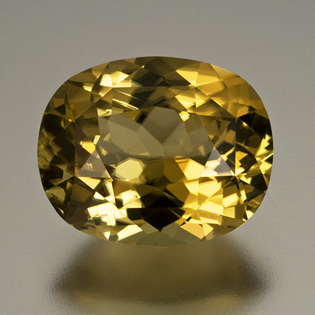 Golden sinhalite from Sri Lanka, 14.36 x 11.64 x 7.93 mm. Inventory #20073 . (Photo: Mia Dixon)