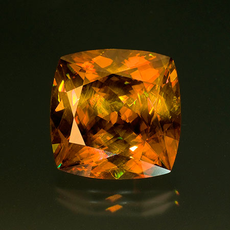 Golden brown sphene. This stone weighs 40.33 carats and measures 20.03 x 20.05 x 12.86 mm. Inventory #18755 . (Photo: Jason Stephenson)