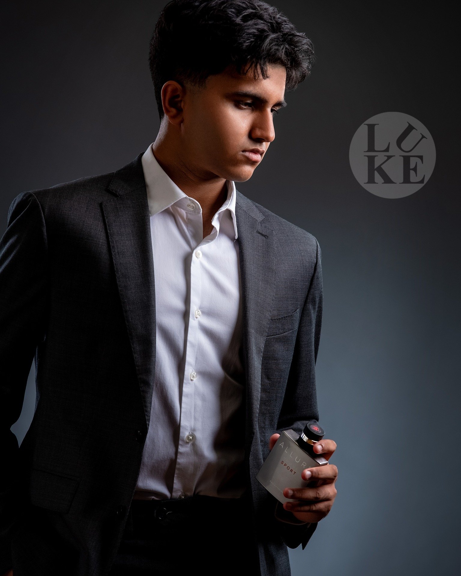 Bonus View: Aadill (Pittsford Mendon HS) sporting a nice grey suit and matching bottle of Allure Sport, by Coco Chanel.
He is an intelligent and kind student who really leans into creativity, so he was &quot;all in&quot; for senior portraits like the