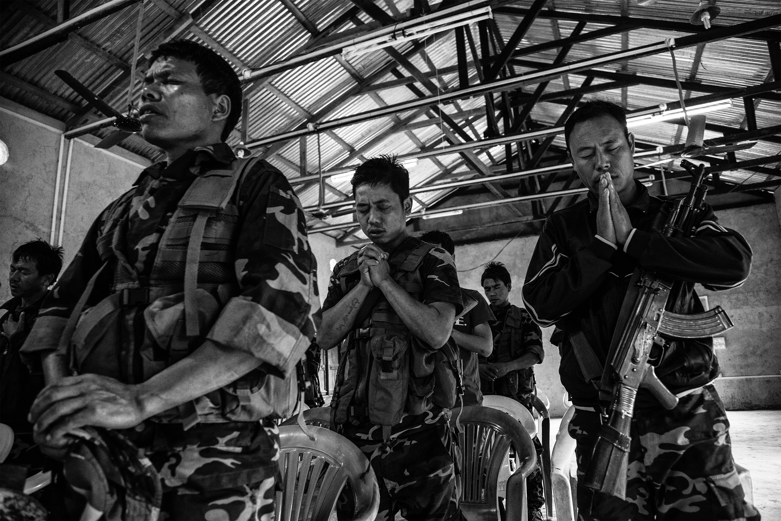 February, 2016: Rebel Cadre of the Zomi Revolutionary Army(ZRA) during morning mass at their camp at an undisclosed location in the Southern Hills of Manipur. The rebel group is at a ceasefire with the Indian Government but there are often reports of skirmishes with opposing factions of Valley based insurgent groups or VBIGs.