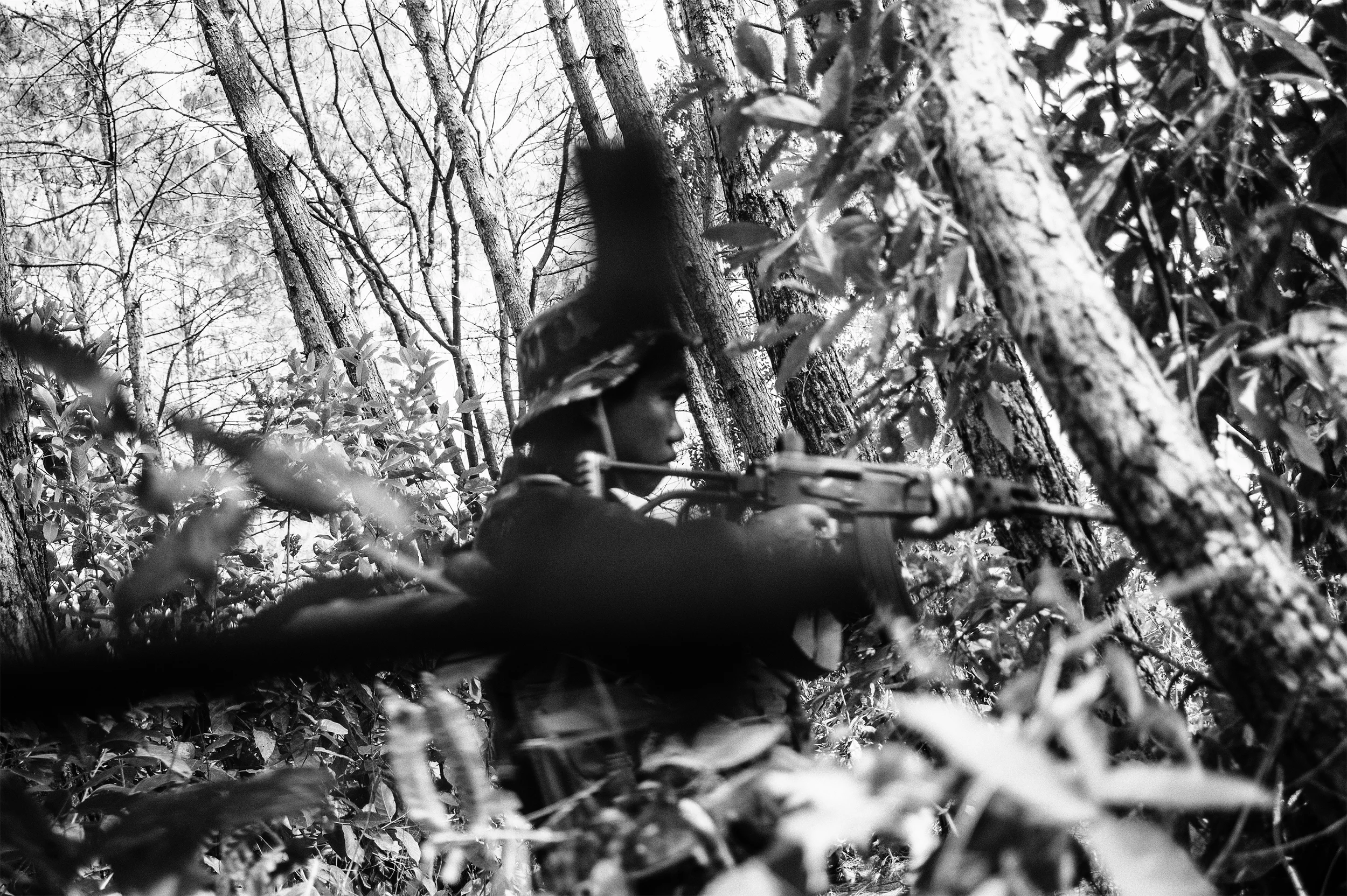 February, 2016: Rebel Cadre of the Zomi Revolutionary Army(ZRA) formed in 1997 to protect the Zomi tribe and its land that they claim extend deep inside Myanmar across the international border during a patrol in the jungles at an undisclosed location in the Southern Hills of Manipur. The rebel group is at a ceasefire with the Indian Government but there are often reports of skirmishes with opposing factions of Valley-based insurgent groups or VBIGs. 