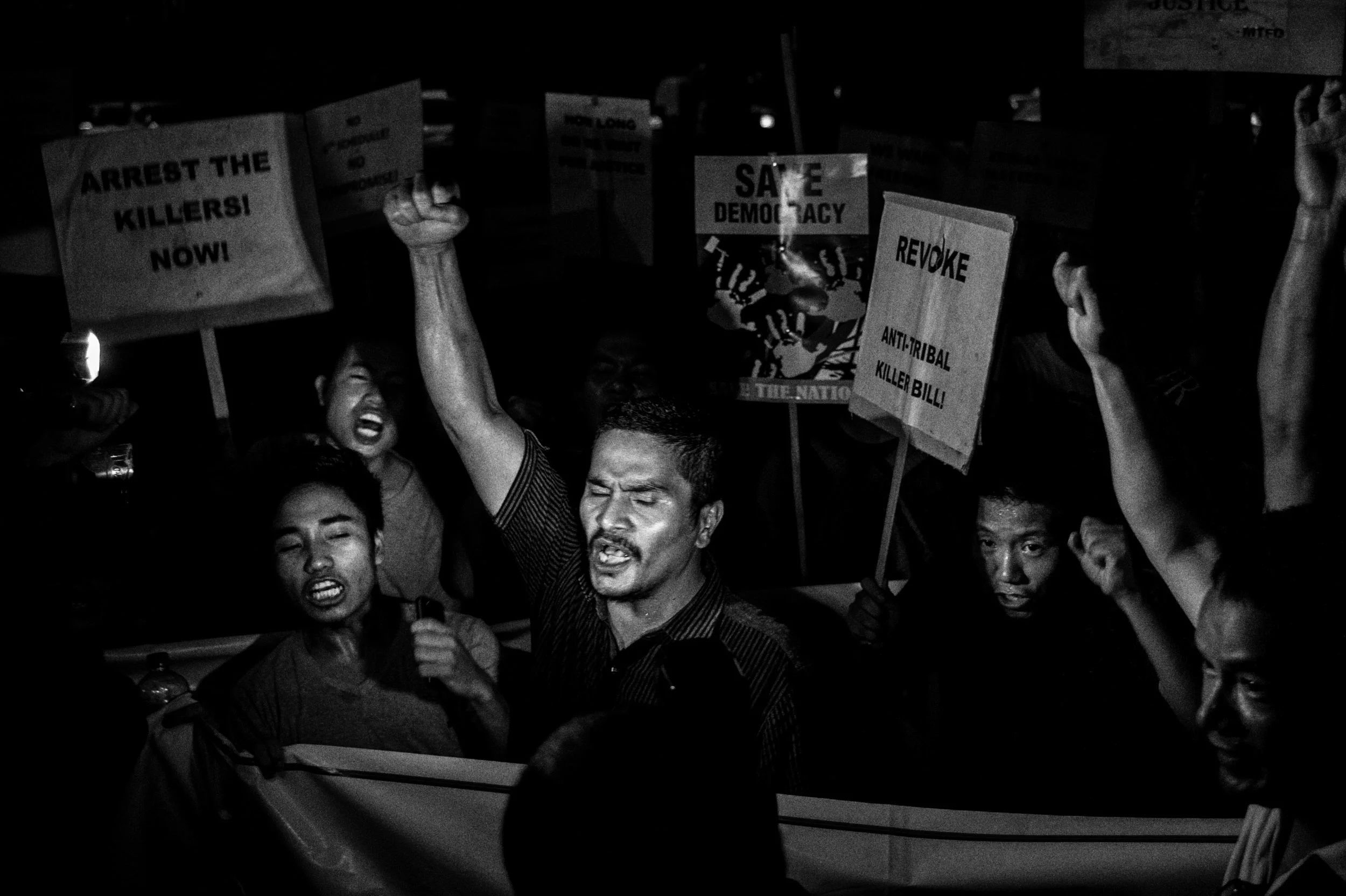  June, 2016: Romeo Hmar (centre) of the Manipur Tribal Forum Delhi and fellow protesters raise their clenched fists in protest at the gates of Manipur Bhawan in Delhi, to protest against a delegation of state legislators in the city to pressure the C