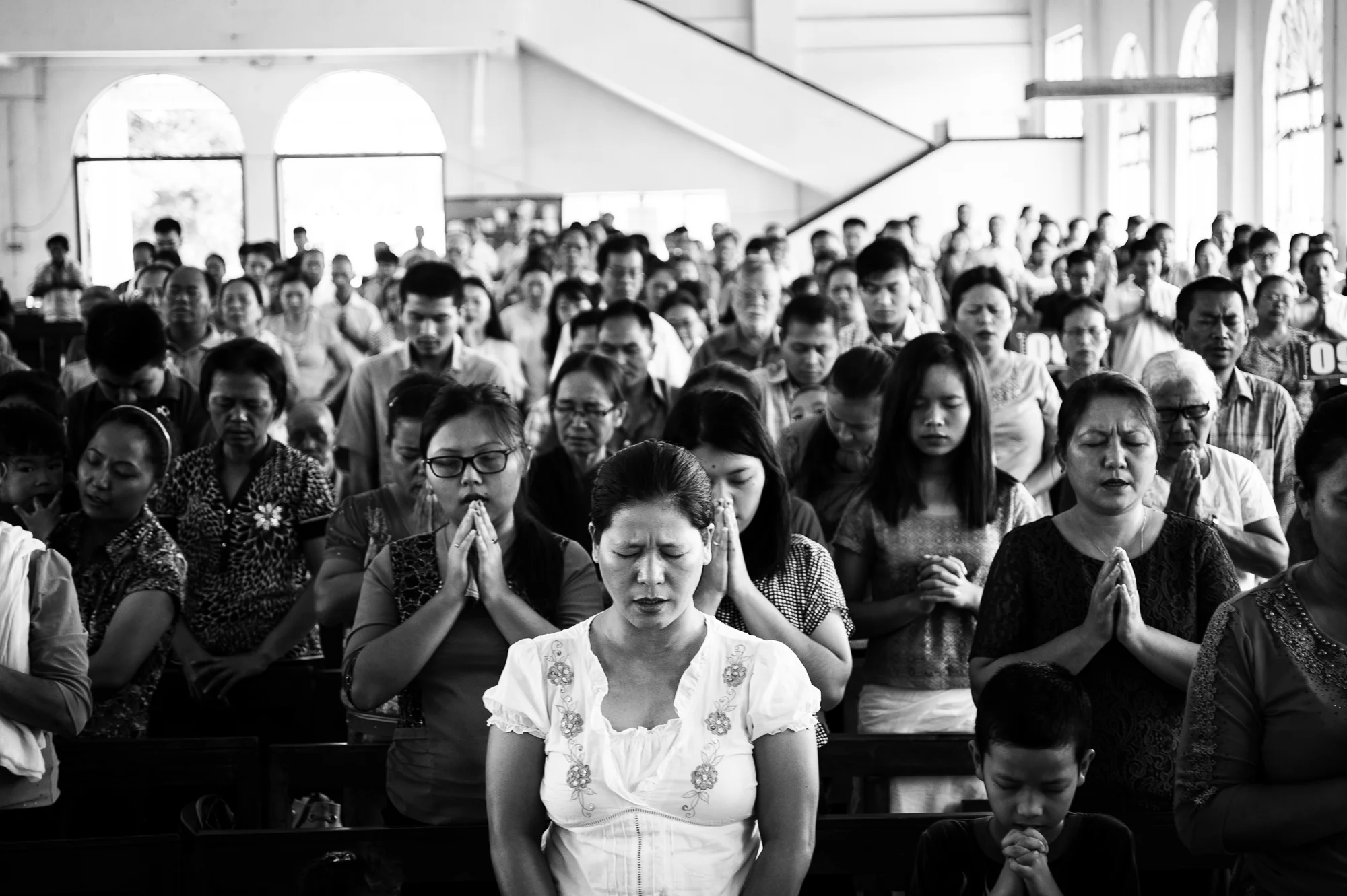 August 2016: At the Hiangtam Lamka EBCC Church, people gathered to pray for the nine dead whose bodies have now been at a ramshackle morgue, a year since they were shot down, in the run up to Tribal Unity Day, in Churachandpur, Manipur. 