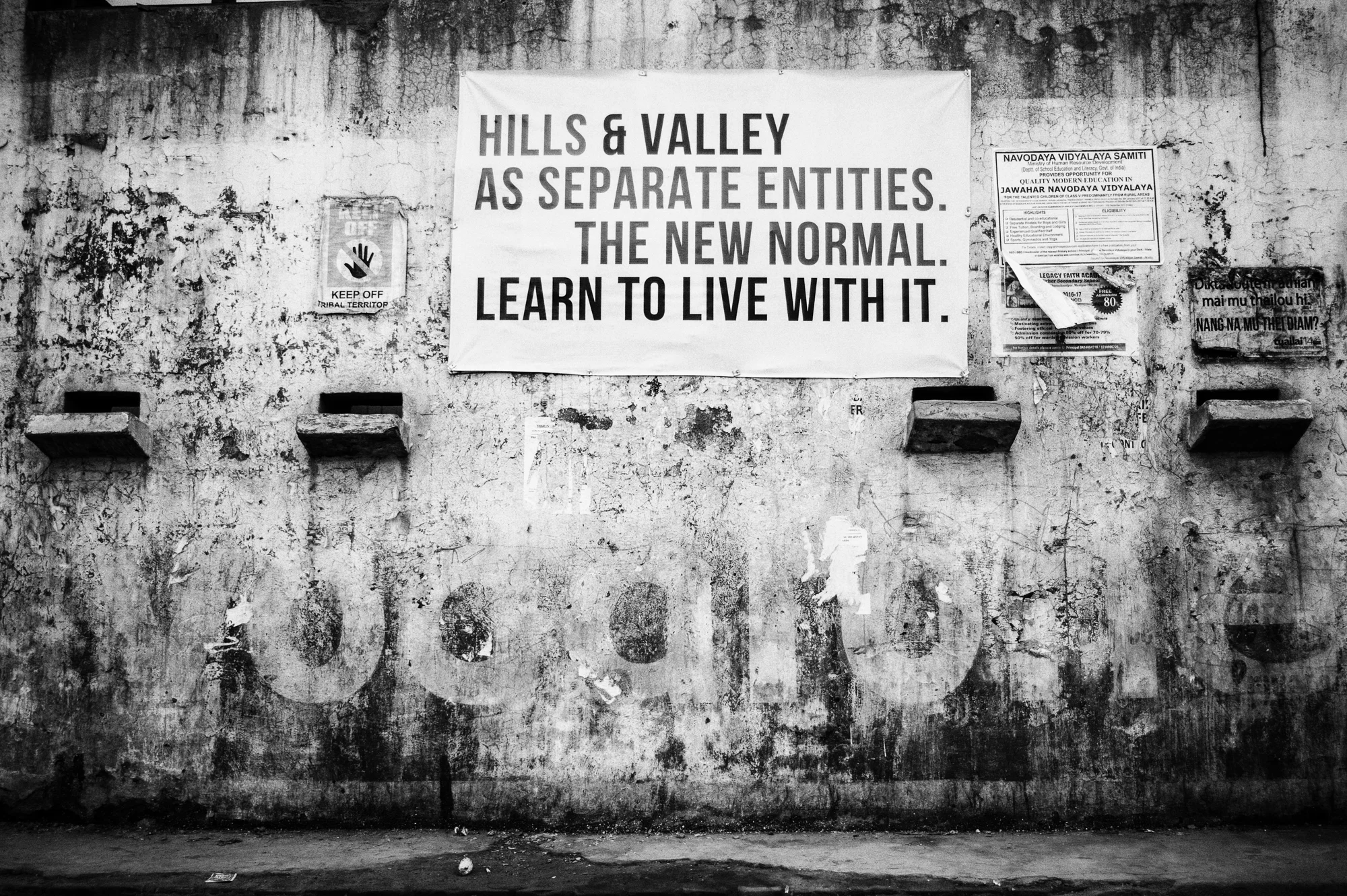 August 2016: The decaying walls of the Police station in Churachandpur, Manipur plastered with slogans talking of the deep-rooted, hill and valley divide as it's commonly referred to here.