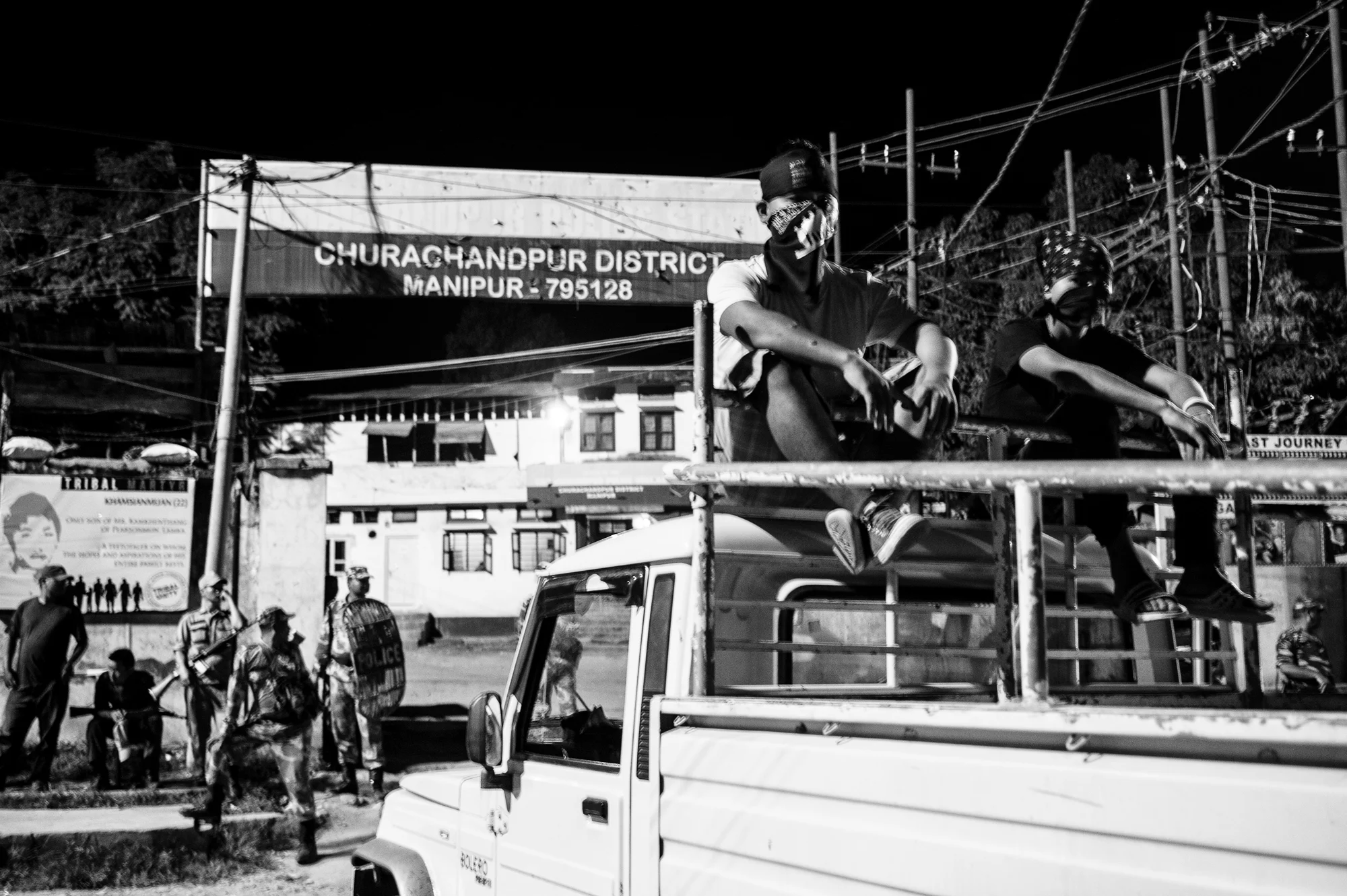 August 2016: Security personnel guard the Churachanpur police station. Outside, volunteers sit atop one of the many pickups they used to mobilise support and organise a programme right outside the station. 