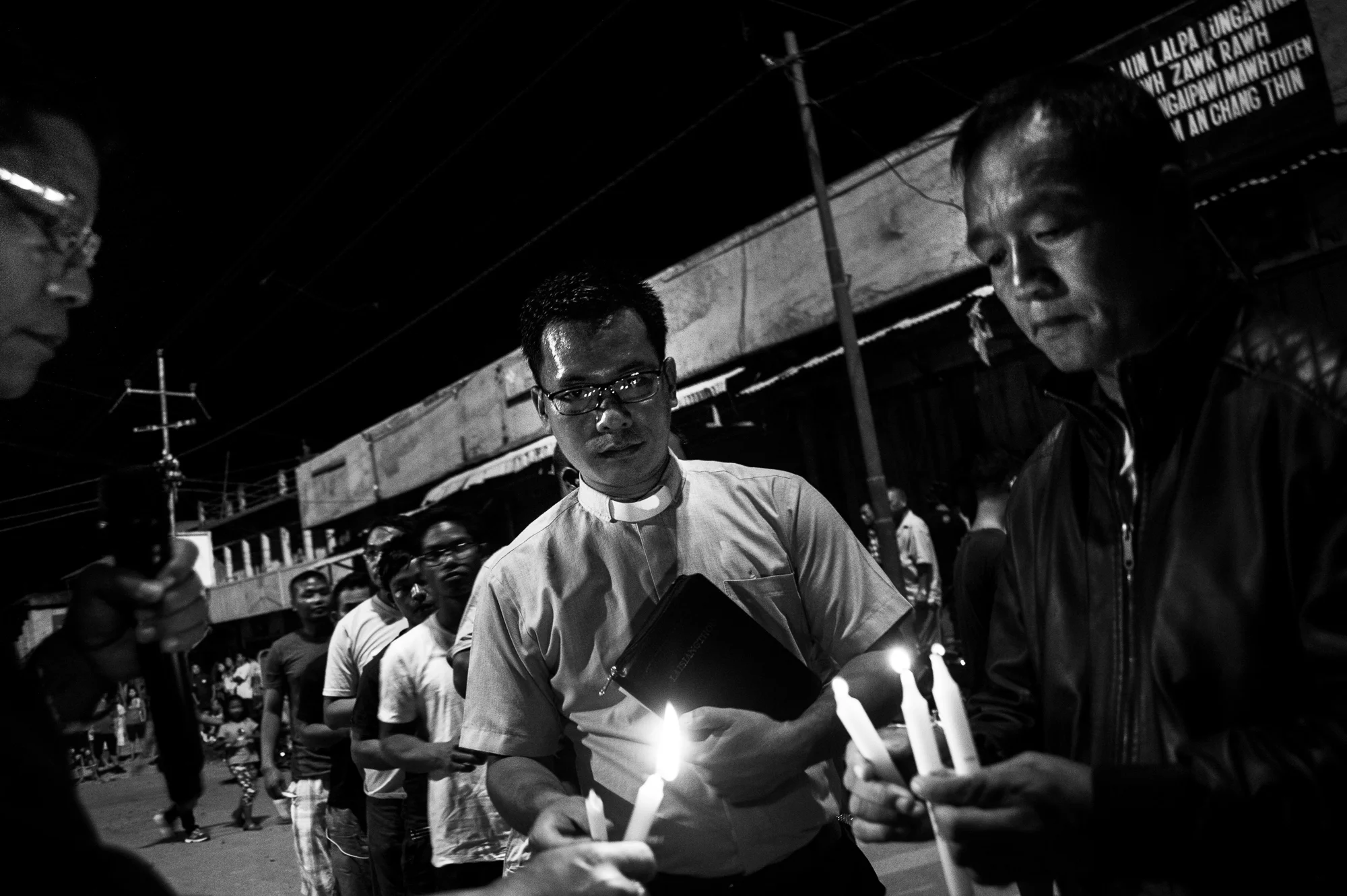 August 2016: Pastor Benson Khuptong, lights a candle in support of the ongoing movement in Churachandpur, Manipur. He later delivered a sermon on the night of August 29, outside the police station where four of the nine who were shot dead during protest had fallen.