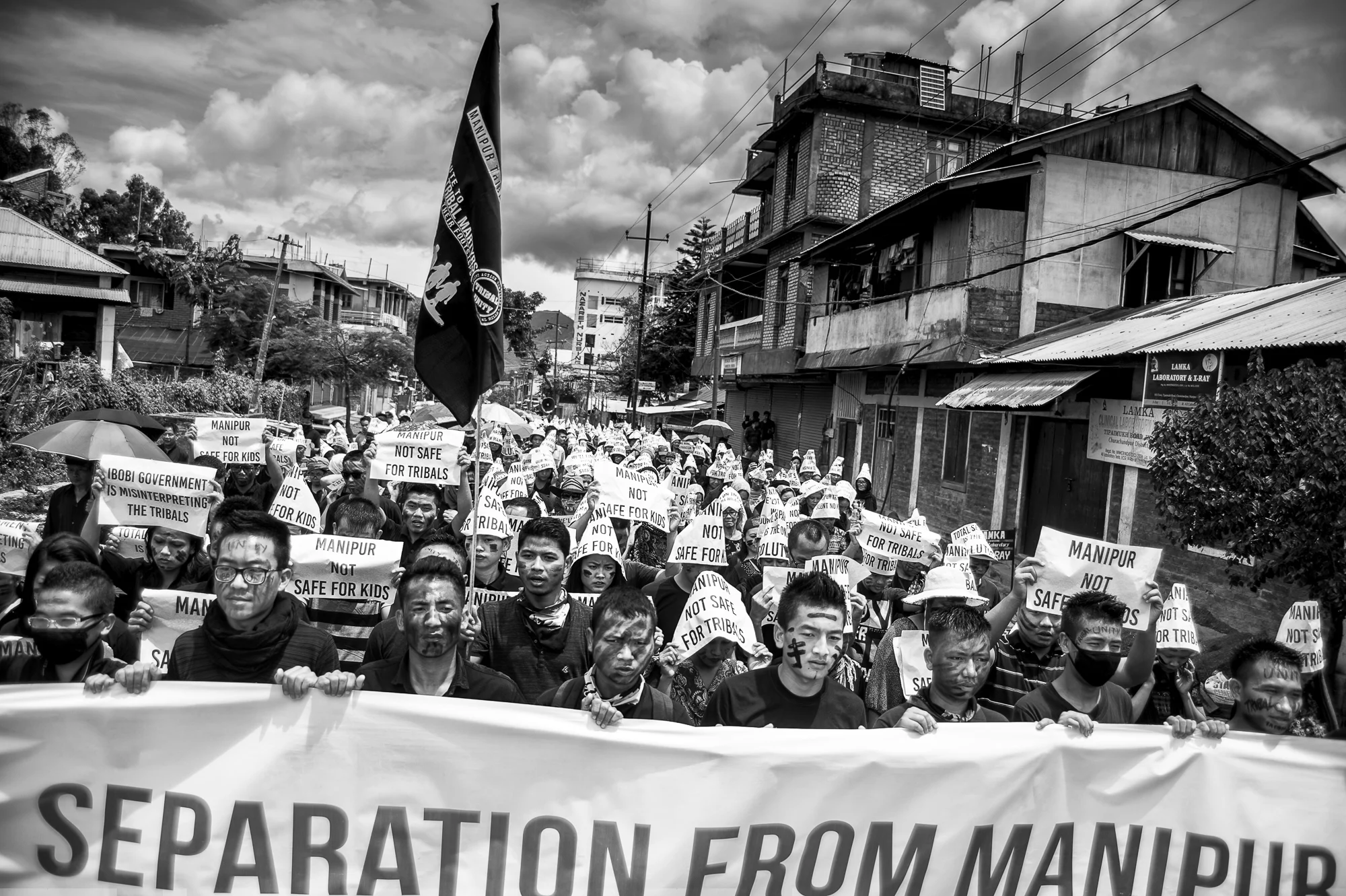 August 2016: Dark clouds gathered as protesters marched through the hills of Churachandpur, chanting slogans.