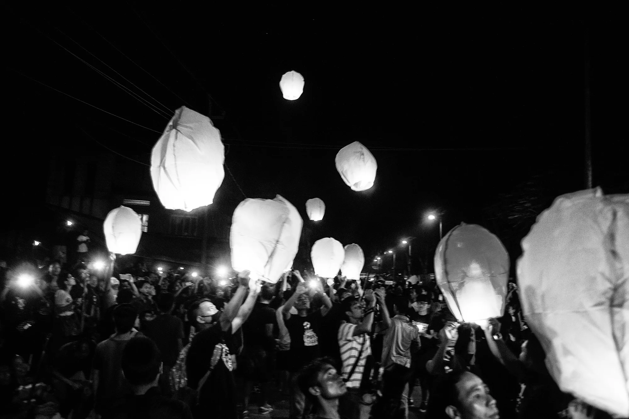 August 2016: On August 30 after the candle light vigil, a large gathering set afloat flying lanterns.