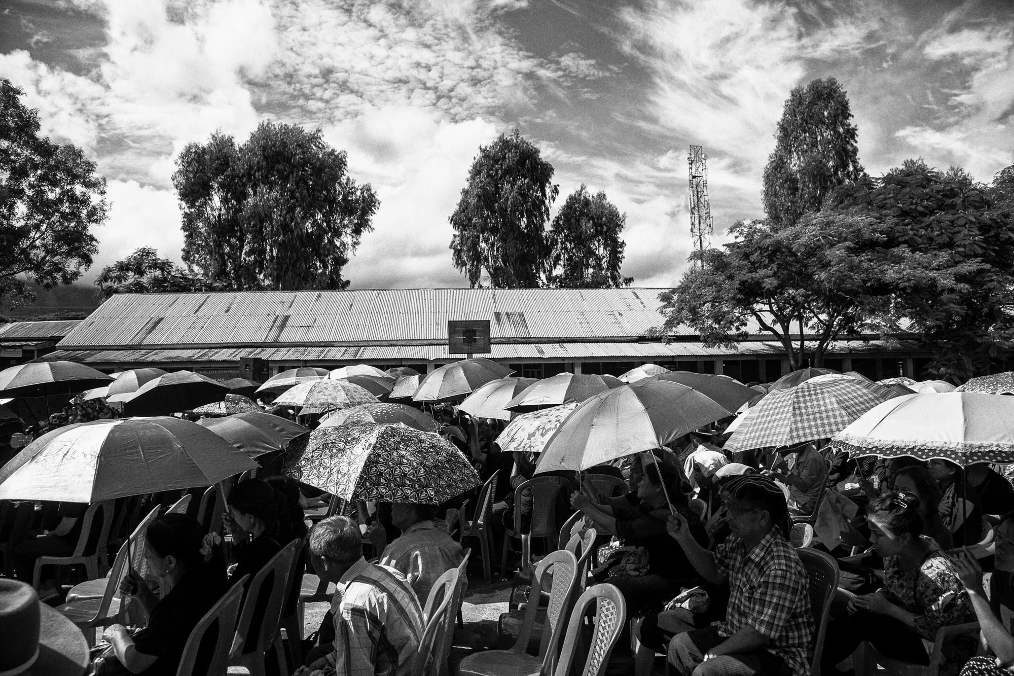 August 2016: Umbrellas glisten in the noon-time sun as thousands gathered to listen to their leaders at the Churachandpur college to mark "Tribal Unity Day" on August 31 , a year from when nine young men died in police action and tribal communities from the hill districts of Manipur came together for the first time in protest.