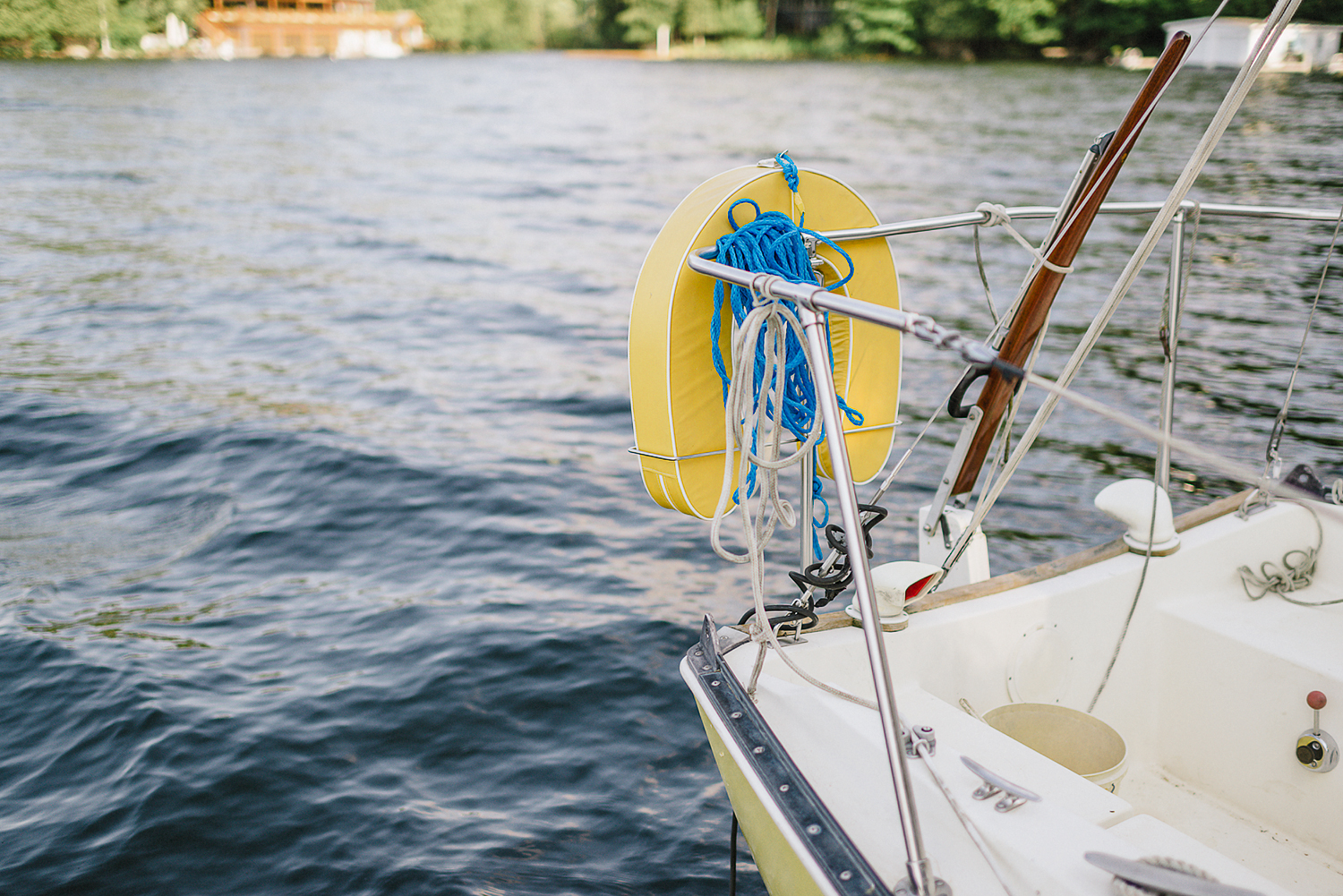 Muskoka-Cottage-Wedding-Photography-Photographer_Photojournalistic-Documentary-Wedding-Photography_Vintage-Bride-Lovers-Land-Dress_Rue-Des-Seins_Forest-Ceremony-Sailboat-Detail.jpg