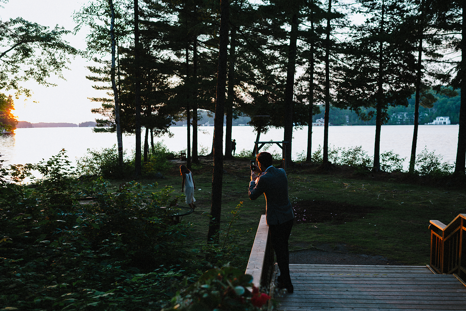 Muskoka-Cottage-Wedding-Photography-Photographer_Photojournalistic-Documentary-Wedding-Photography_Lakeside-Ceremony-Sunset-Light-guests.jpg