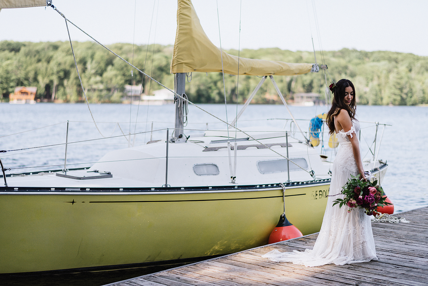 Muskoka-Cottage-Wedding-Photography-Photographer_Photojournalistic-Documentary-Wedding-Photography_Vintage-Bride-Lovers-Land-Dress_Rue-Des-Seins_Bridal-Portrait-Boho-bride-sailboat-lake.jpg