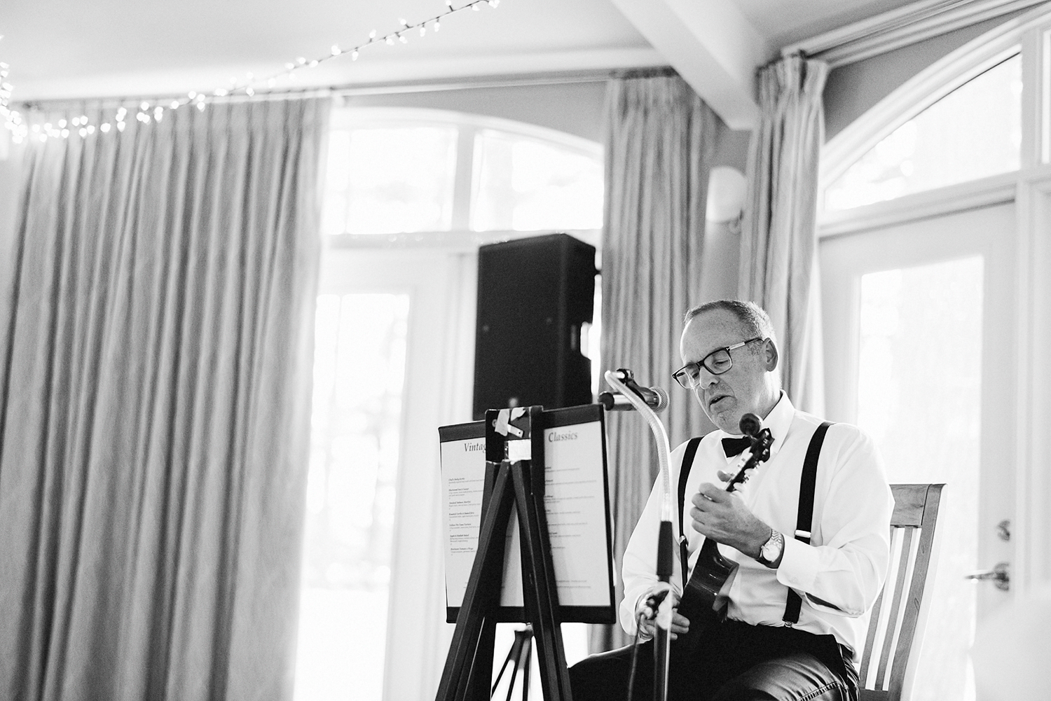 Muskoka-Cottage-Wedding-Photography-Photographer_Photojournalistic-Documentary-Wedding-Photography_Vintage-Bride-Lovers-Land-Dress_Nature_Film_Sherwood-Inn-Reception-Venue-Dad-playing-Ukelele.jpg