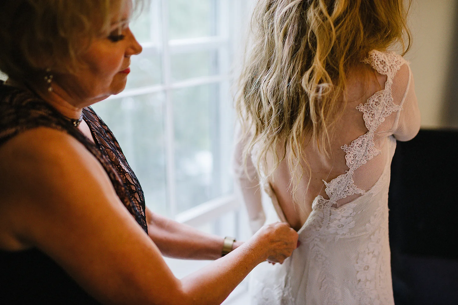 Best-Moody-Documentary-Wedding-Photography-Vintage-Small-Town-Chapel-Wedding-Toronto-Ontario_Candid-Bride-mom-zipping-dress.jpg