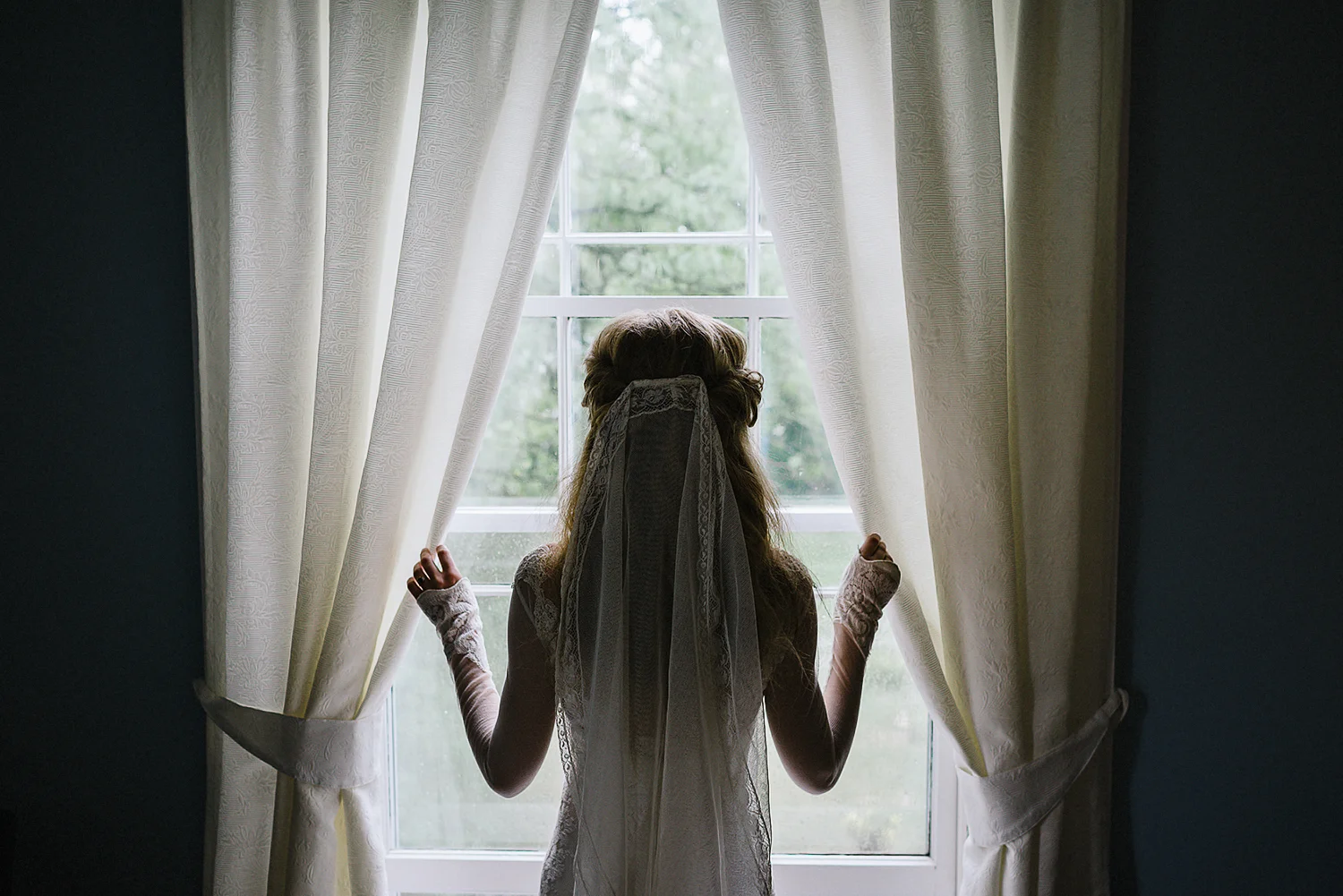 Best-Moody-Documentary-Wedding-Photography-Photojournalism-Vintage-Small-Town-Chapel-Wedding-Toronto-Ontario_Candid-Bride-Portrait-by-window.jpg