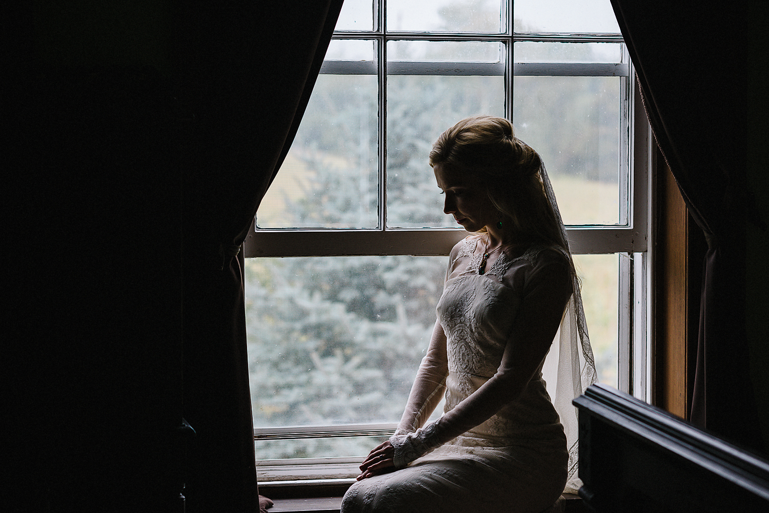 Best-Moody-Documentary-Wedding-Photography-Photojournalism-Vintage-Small-Town-Chapel-Wedding-Toronto-Ontario_Candid-Bride-vintage-portrait-sitting-by-window.jpg