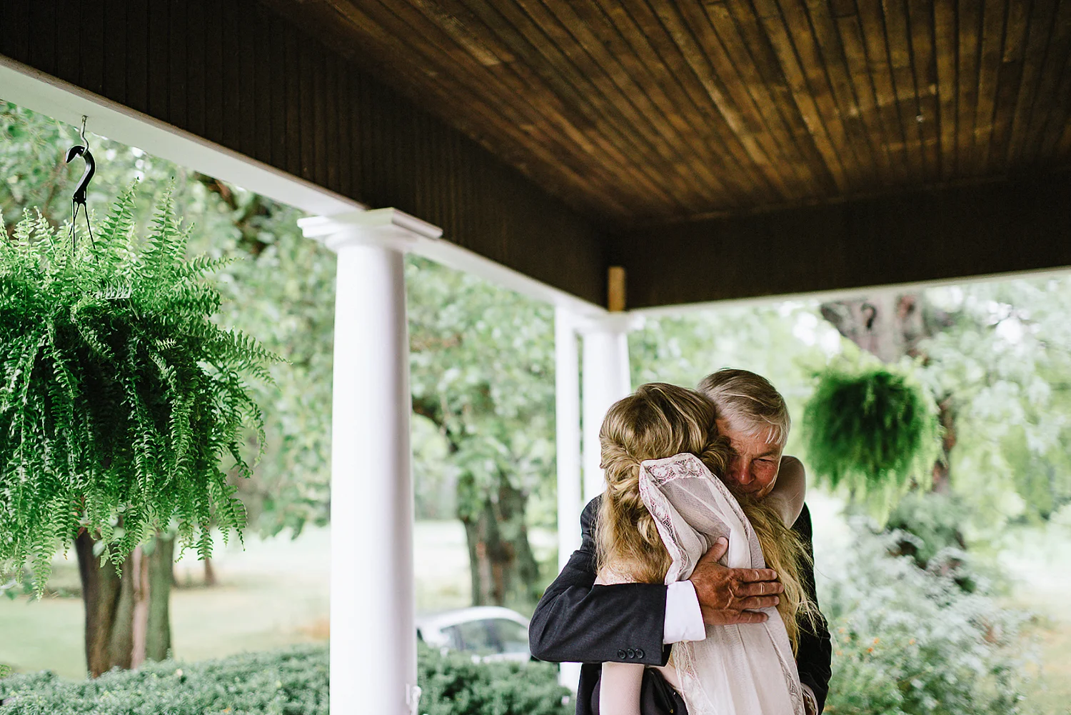 Best-Moody-Documentary-Wedding-Photography-Photojournalism-Vintage-Small-Town-Chapel-Wedding-Toronto-Ontario_Father-of-groom-hugging-bride.jpg