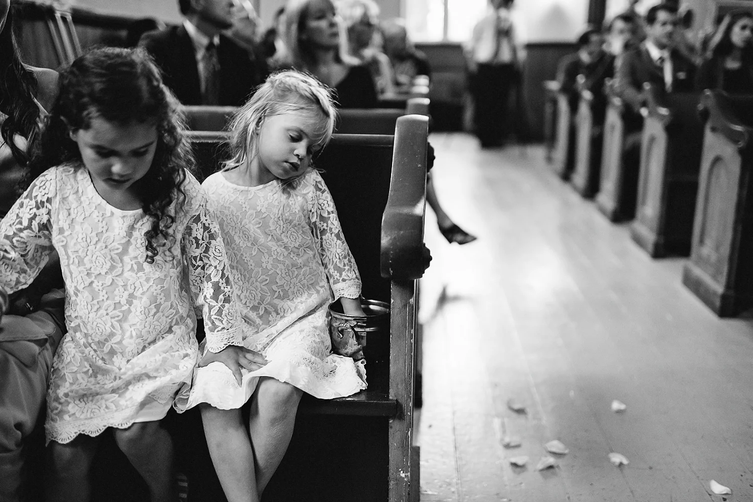 Best-Moody-Documentary-Wedding-Photography-Photojournalism-Vintage-Small-Town-Chapel-Wedding-Toronto-Ontario_Ceremony-Flower-Girl-Sleeping.jpg